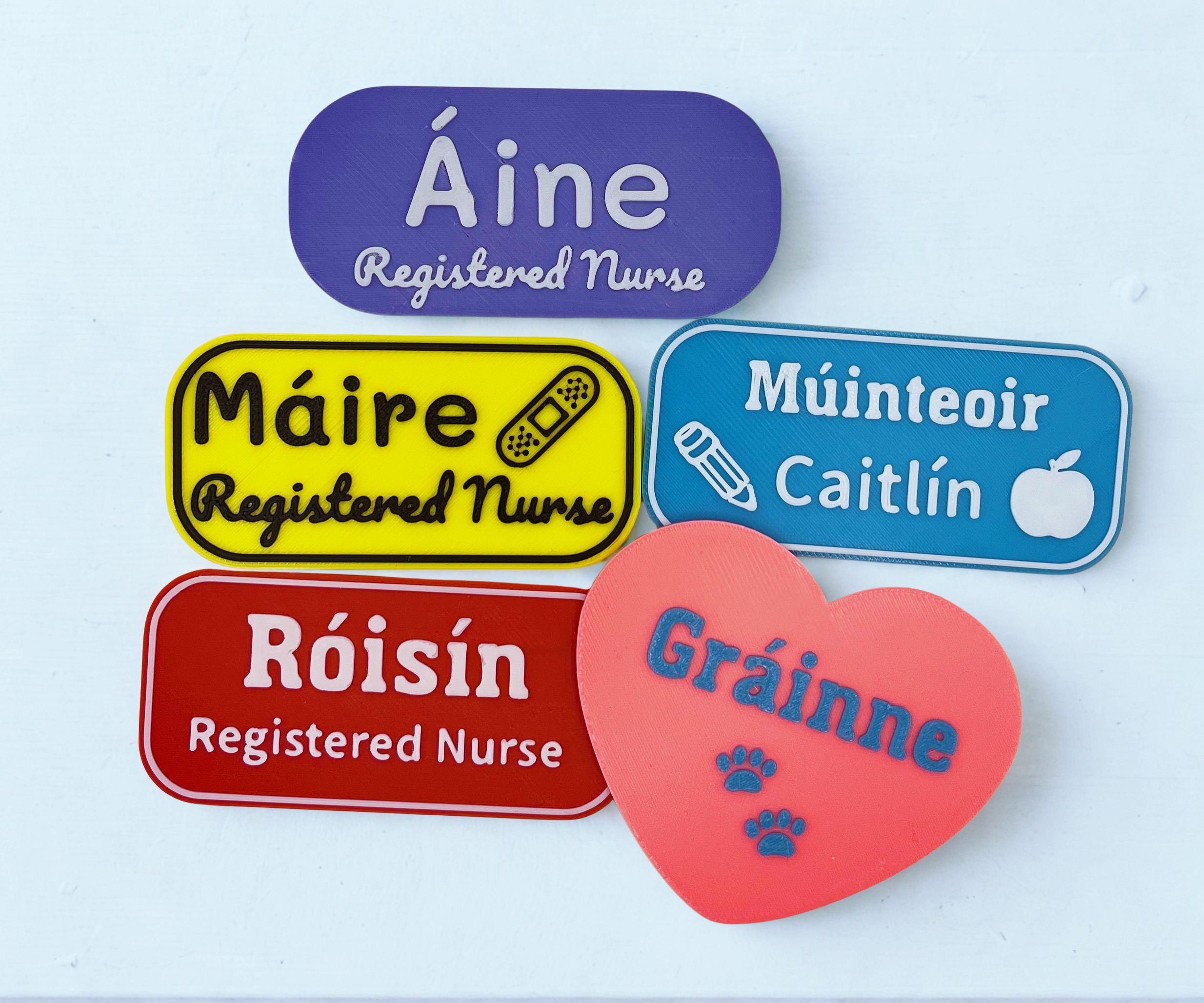 Collection of Kind Badges showing healthcare and education professionals with Irish names